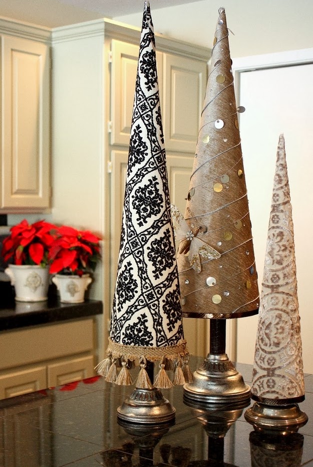 http://www.thecreativityexchange.com/2010/12/fabric-covered-poster-board-christmas-tree-cones.html